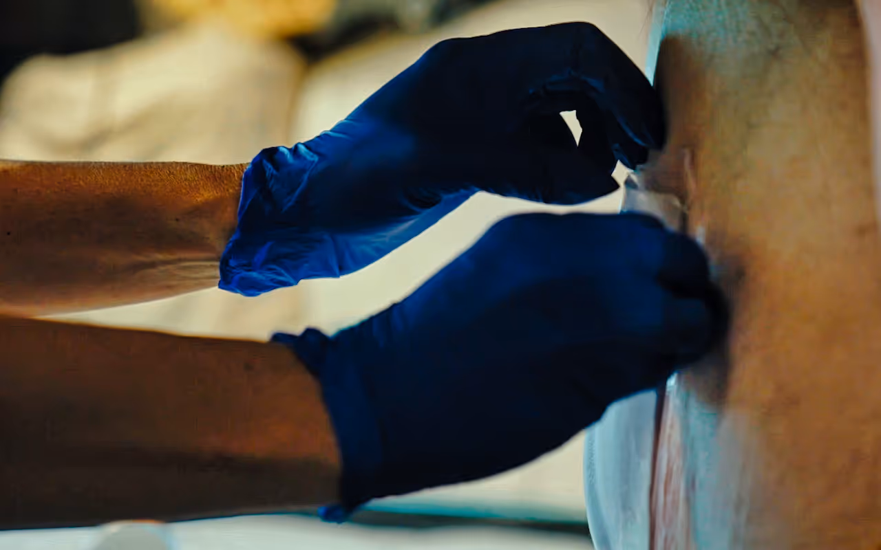 Wound care nurse attending to a patient's needs